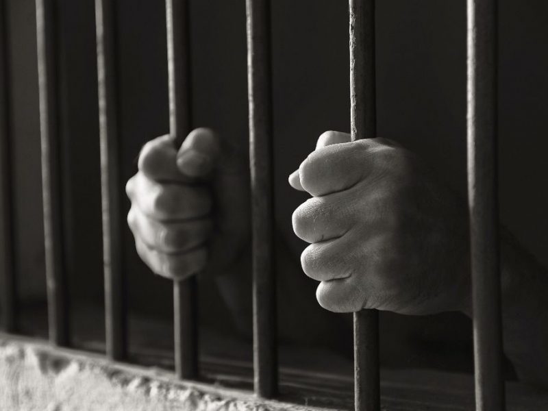 Hands holding the bars