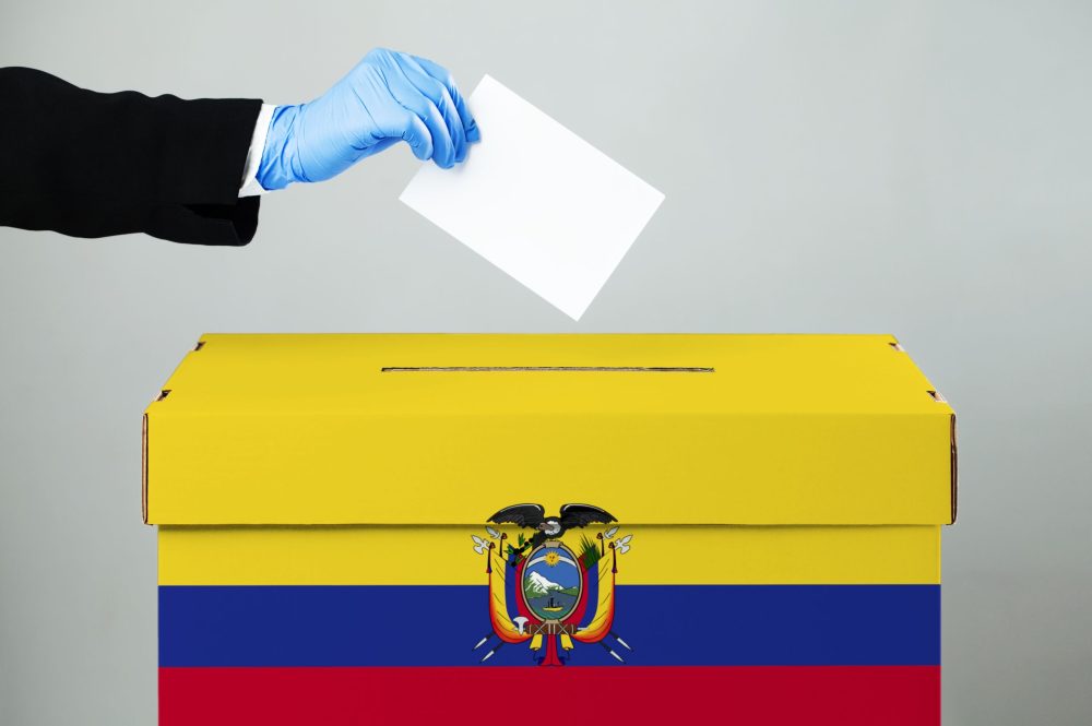 Person,Wearing,Suit,Casting,Vote,In,Ballot,Slot,hand,In,Blue